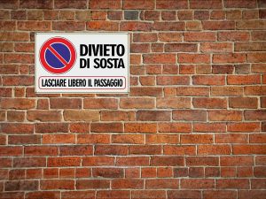 È assoggettabile all’imposta Cosap il passo carraio realizzato a livello della strada e privo di opere?